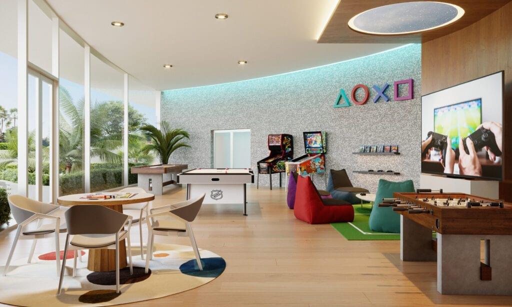 Modern children's playroom with colorful seating, activity areas, and large windows at Aria Reserve Residences.